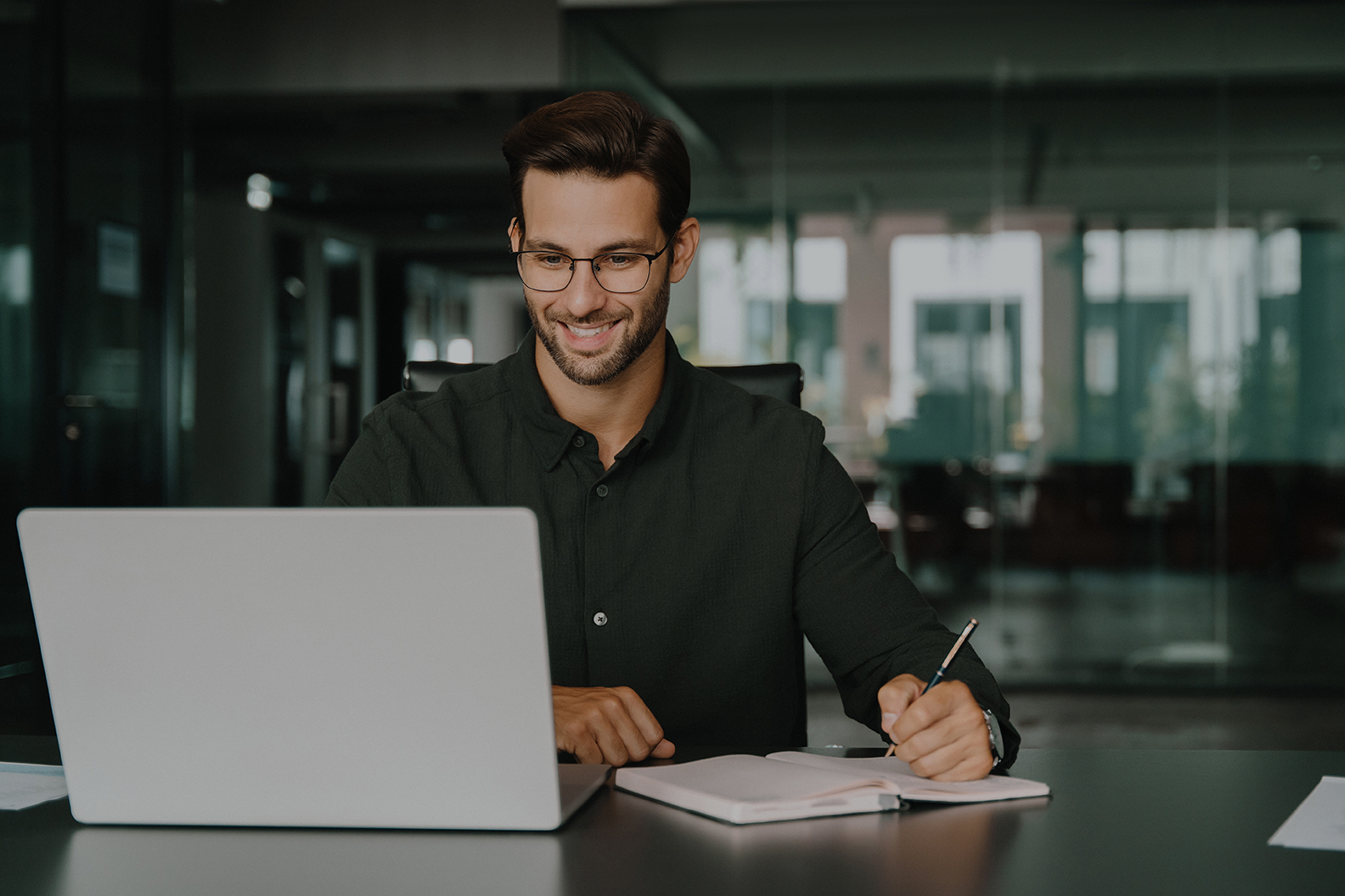 Young,Student,Man,Using,Laptop,Computer,For,Business,Studying,,Watching